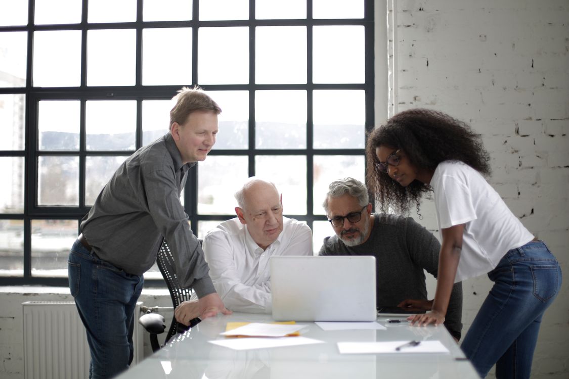 Small business team reviewing work together